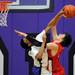 Pioneer High School's Tevis Robinson fouls a shot by Bedford High School's Jackson Lamb during the second quarter at Pioneer on Tuesday, Feb. 19, 2013. Melanie Maxwell I AnnArbor.com